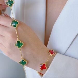 Elegant Gold and Red Clover Bracelet